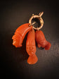 EARLY 19TH CENTURY PUNCHINELLO CORAL PENDANTS WITH LARGE BOLT RING BAIL