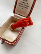 EARLY 19TH CENTURY CORAL HAND WITH BINOCULARS PENDANT