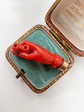 EARLY 19TH CENTURY CORAL HAND WITH BINOCULARS PENDANT