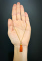 EARLY 19TH CENTURY CORAL HAND WITH BINOCULARS PENDANT