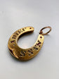 VICTORIAN DIAMOND & RUBY 15CT GOLD HORSESHOE PENDANT ‘SANS ADIEU’