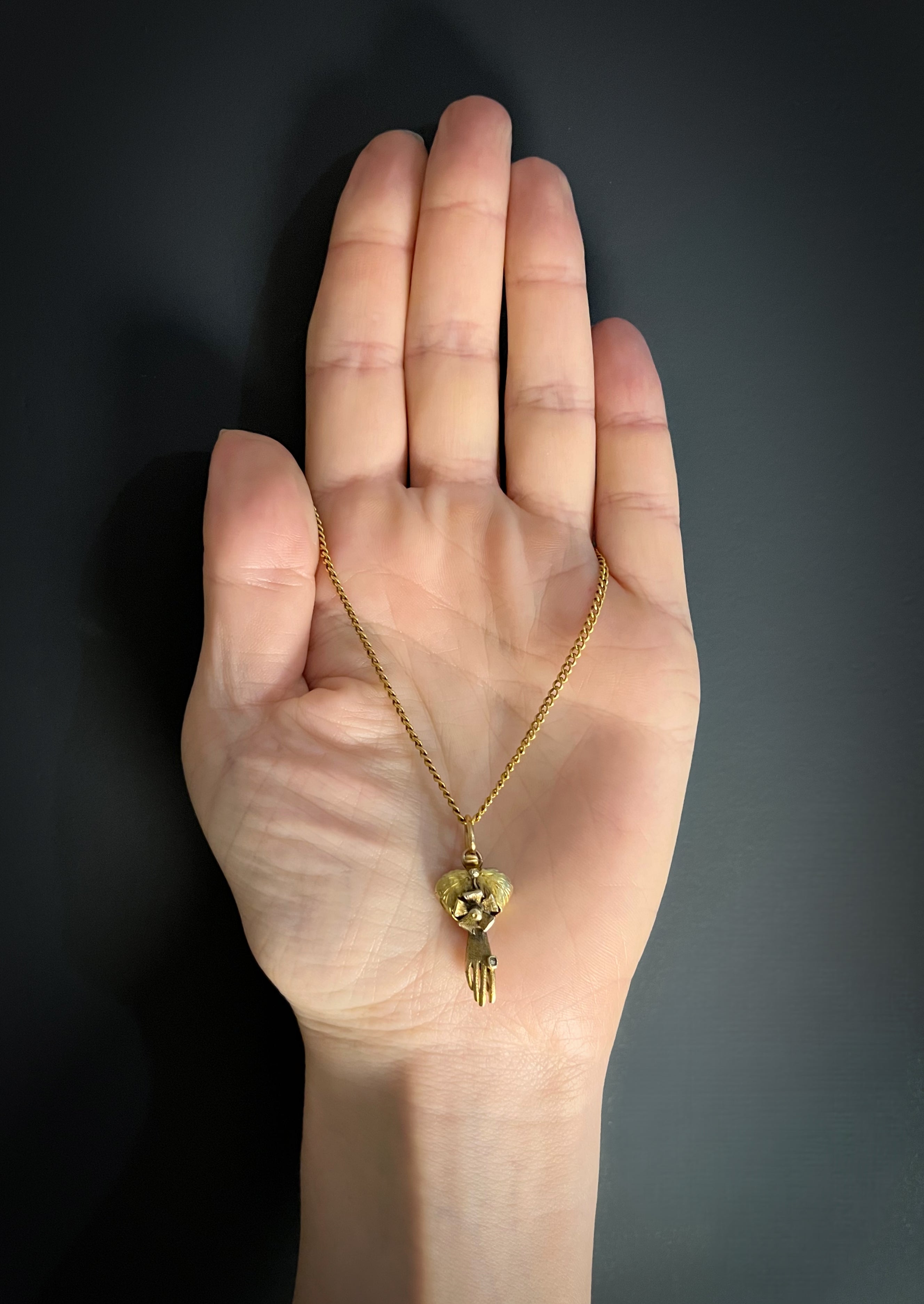 Gold on sale fist pendant