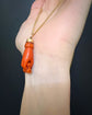 EARLY 19TH CENTURY CORAL HAND WITH BINOCULARS PENDANT