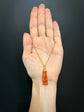 EARLY 19TH CENTURY CORAL HAND WITH BINOCULARS PENDANT