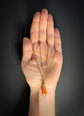 19TH CENTURY CORAL & 18CT GOLD HAND PENDANT