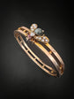 CHUNKY 15CT GOLD BANGLE WITH A LARGE GEM SET FLY