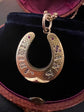 VICTORIAN DIAMOND & RUBY 15CT GOLD HORSESHOE PENDANT ‘SANS ADIEU’