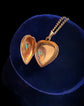 A VICTORIAN 15CT GOLD LOVE HEART PENDANT