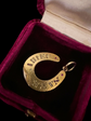 VICTORIAN DIAMOND & RUBY 15CT GOLD HORSESHOE PENDANT ‘SANS ADIEU’