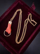 19TH CENTURY CORAL & 18CT GOLD HAND PENDANT