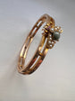 CHUNKY 15CT GOLD BANGLE WITH A LARGE GEM SET FLY