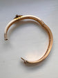 CHUNKY 15CT GOLD BANGLE WITH A LARGE GEM SET FLY