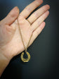 VICTORIAN DIAMOND & RUBY 15CT GOLD HORSESHOE PENDANT ‘SANS ADIEU’