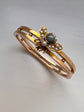 CHUNKY 15CT GOLD BANGLE WITH A LARGE GEM SET FLY