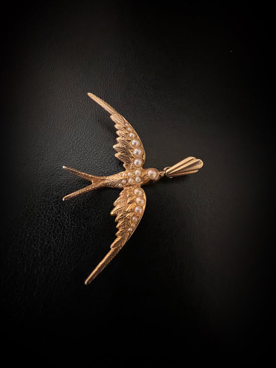 A 9CT GOLD & PEARL SWALLOW PENDANT