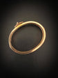 CHUNKY 15CT GOLD BANGLE WITH A LARGE GEM SET FLY