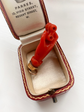 EARLY 19TH CENTURY CORAL HAND WITH BINOCULARS PENDANT