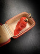 EARLY 19TH CENTURY CORAL CHERUB PADLOCK PENDANT