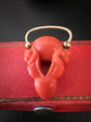 EARLY 19TH CENTURY CORAL CHERUB PADLOCK PENDANT