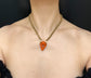 EARLY 19TH CENTURY CORAL CHERUB PADLOCK PENDANT